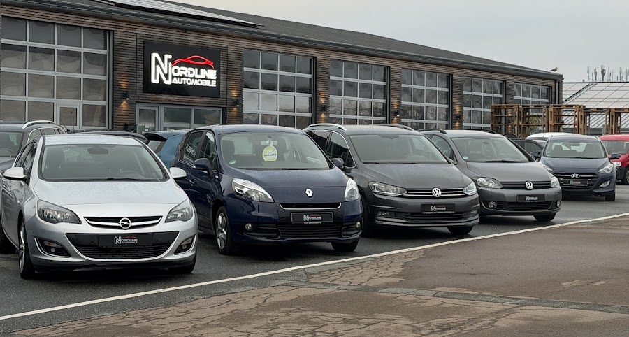 NORDLINE Automobile showroom with a row of cars outside